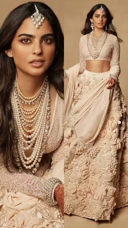  Isha Ambani Shines in Ivory Sabyasachi Lehenga at Brother Anant’s Wedding Reception